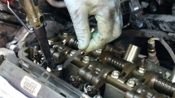 Precision valve adjustment.