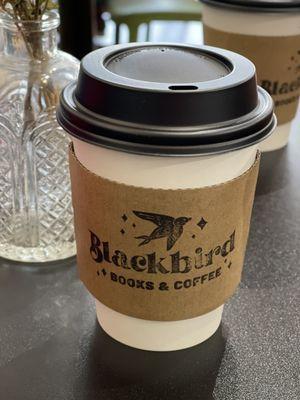 Salted caramel latte in foreground and gold milk latte behind.