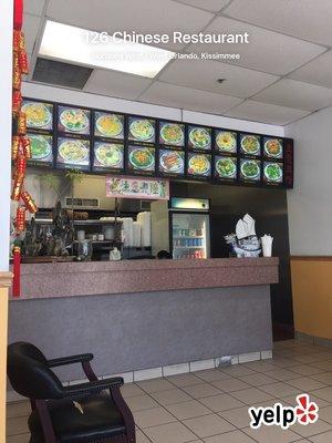 Counter with outdated food board.