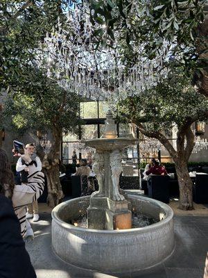 Real 100 year old olive trees planted inside RH  restaurant with gorgeous fountains and exquisite chandeliers!