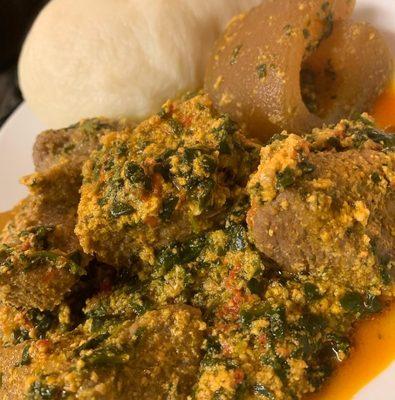 Poundo Yam with egusi soup with goat meat or beef. Ponmo.