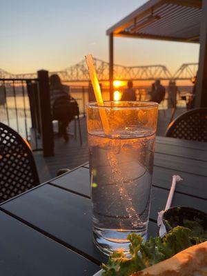 A beautiful sunset and a lovely beverage! Come visit eat, have a great beer. Great place,food and people