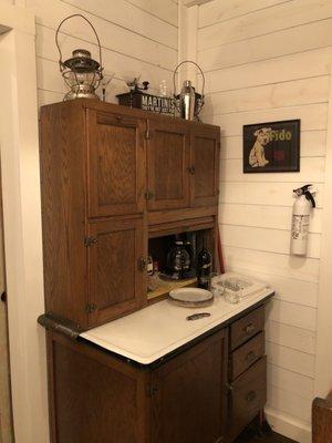 Vintage kitchen cabinet complete with a bottle of wine upon arrival