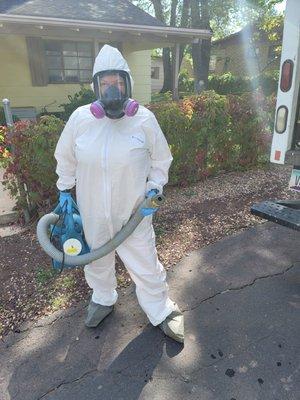 A fresh set of PPE and a fogger full of chemicals, this biohazard technician is ready to finish out this cleanup.