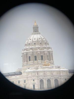 The view of the Capitol from the binoculars.