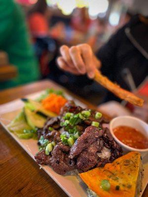 broken rice with grilled beef and egg rolls