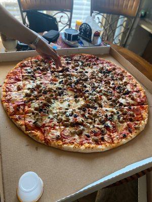 The Pointersaurus Cheese Pizza with back olives, pepperoni and Italian style sausage.