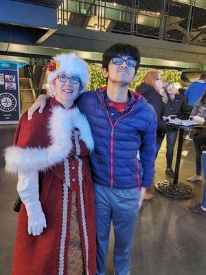 Mrs. Claus and Rohan Tankha at Enchant Christmas Seattle.