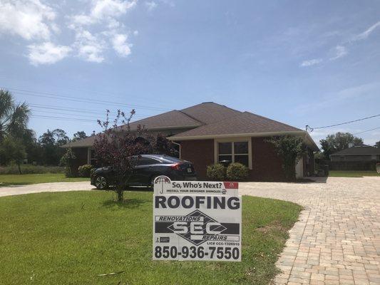 Wind damage to roof repaired by SEC Roofing.