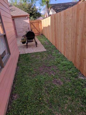 Portion of fence that was replaced, along with large gate.