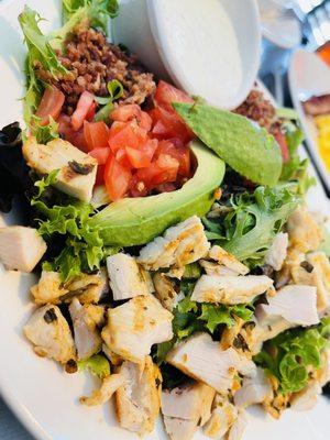 Cobb salad with blue cheese crumbles on the side