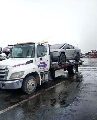 Transporting a Tesla Cybertruck  for 24/7 Towing, Roadside, and Exotic transport call Able Towing 407-866-3464