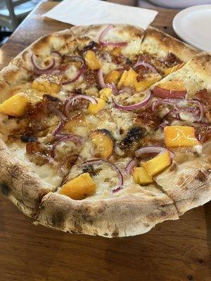 Peach and prosciutto seasonal pizza