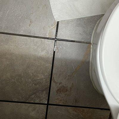 Water on bathroom floor upon arrival