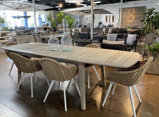 Cavallo extension dining table in weathered teak paired with the Moraga dining chairs in natural.