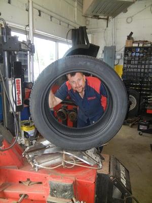 Belgium Service Center owner, Dave Kaan replacing 22" tires for a customer.