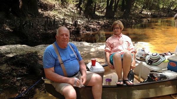 Ed is relaxing on the river in his Colquitt Shopper shirt with his wonderful wife Vivian.