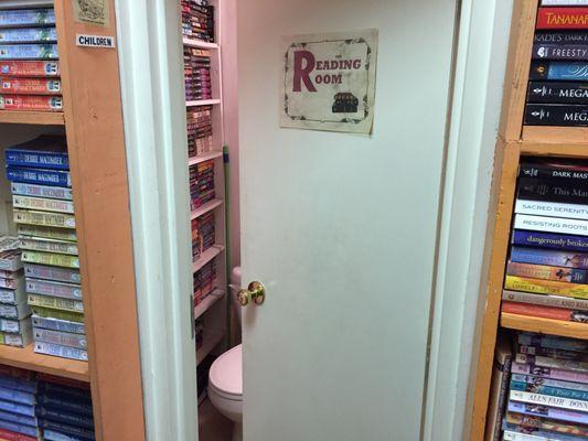 Sign on restroom door says the "Reading Room."