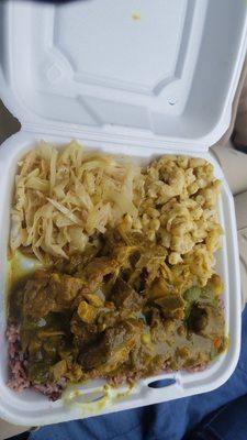 Medium goat curry with cabbage and mac n cheese