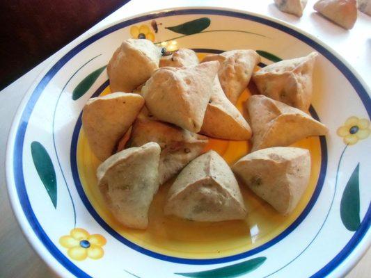 Fatoyer - spinach-stuffed hand pies seasoned with onion, lemon, and Syrian spice sumac.