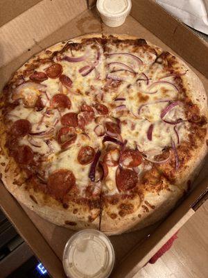 Traditional eight cut pizza with purple onions and pepperoni