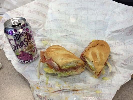 Italian sandwich, medium, with soda can for perspective.