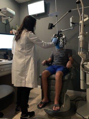 Very clean exam room with shield protecting patient, and Dr. Lac wore mask & gloves too!