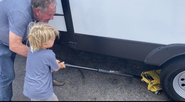 Showing my son how to Jack the trailer.