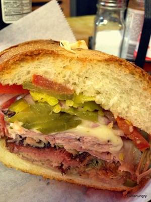 Mojo | $8 | 4.3/5 | smoked pork shoulder, ham, swiss, pickles, tomato, onions, spicy cuban "Mojo" sauce, on a toasted roll.