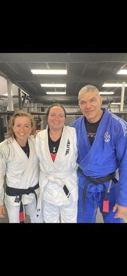 My coaches and I after I earned my first Brazilian jujitsu stripe on my white belt.