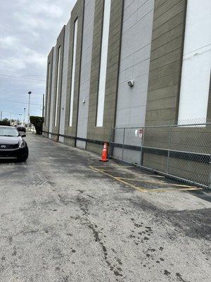 This is the alley with space for five cars the rest line up against the wall creating havoc when full one way in one out