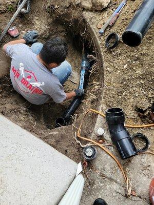 In this photo we are Repairing Sewer Mainline due to Roots in the line.