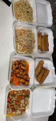 Pork fried rice, pork chow mein, orange chicken spring rolls and kung pao chicken.