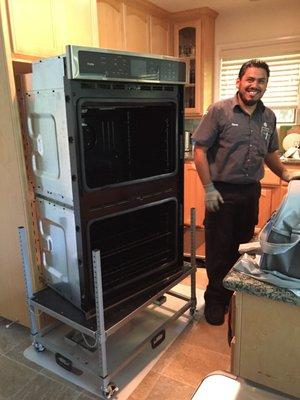 Rene from GE appliance repair replacing the convection fan on my oven on July 11, 2018.