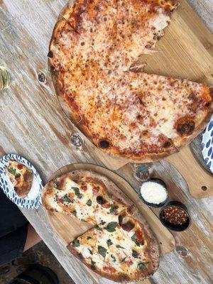 Lower pie is the Margerita and the upper pie is the cheese. Epic pizza comes out at 900 degrees from Peters wood fired pizza oven on weekend