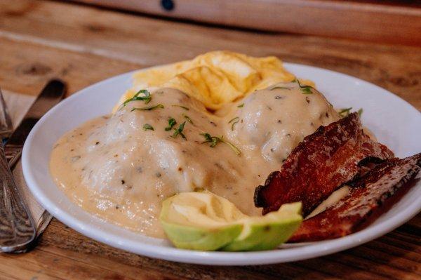 biscuits and gravy with bacon avocado and scrambled egg