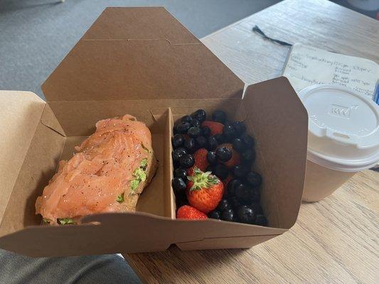 Avocado toast w/ smoked salmon and fruit side.