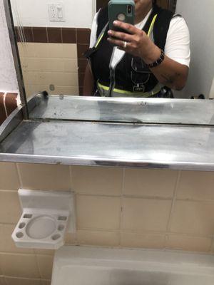 body fluid splatters on mirror in bathroom