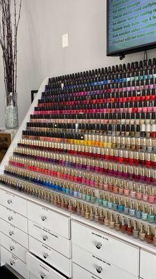 Regular nail polish wall. They have more than 1,000 colors in regular polish, gel polish, SNS dip powder, and colorful acrylic powder!