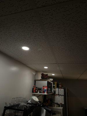 Recessed lighting in basement kitchen on dimmer.