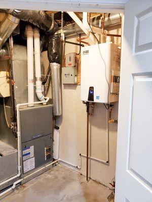 Two 50 gallon water heaters were replaced with one Navien NPE-240A tankless water heater