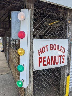 Hot boiled peanuts sign at the building corner. With colorful flashing lights, like a carnival.