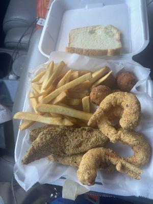 Fish and jumbo shrimp combo with two sides (fries and hush puppies).