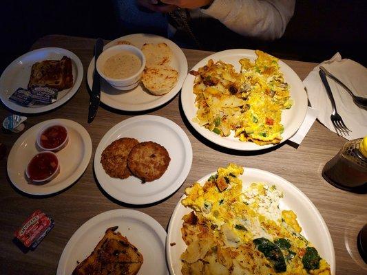 Mediterranean omelet, veggie omelet, turkey sausage, coffee, salsa, SOS, and raisin bread.