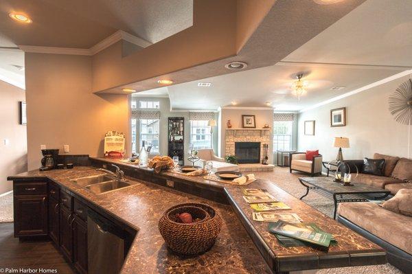 This "center-of-the-universe" kitchen keeps the dirty dishes hidden but gives you a great view of the whole house! Palm Harbor homes