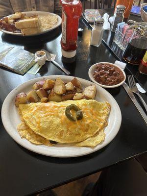 Veggie omelette home fries and Chili on the side