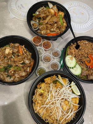 Drunken noodles with chicken, drunken noodles with seafood, pad Thai with tofu, and basil fried rice with beef