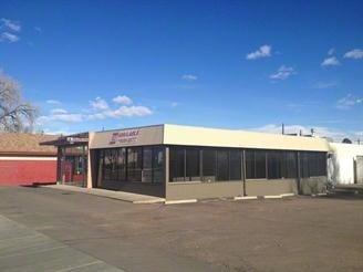 Storefront. The entrance is next to the red building, on the very left hand side of this photo.