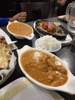 Butter Chicken up close and the Narangi Murg Tikka (tandoori grilled chicken) in the back.