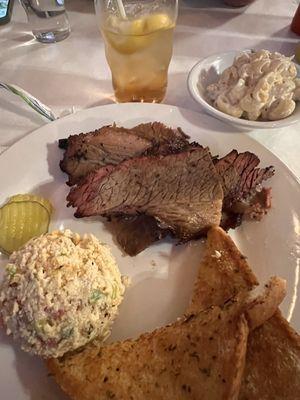 Biscuit platter with corn bread salad and macaroni and sweet tea